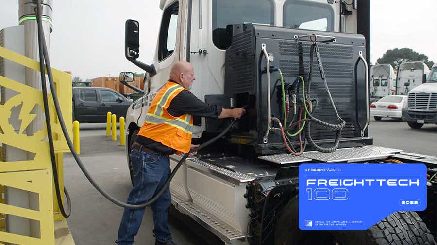 Schneider driver plugs in electric truck.