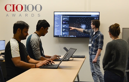 Image of Schneider associates assessing technology advancements and ongoing enhancements for carriers, shippers and Schneider
