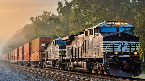 NS_OCT2026_hero no logo.jpg Schneider intermodal boxes and Norfolk Southern Train