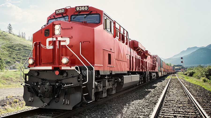 A Canadian Pacific train pulling double stacked containers on the rail