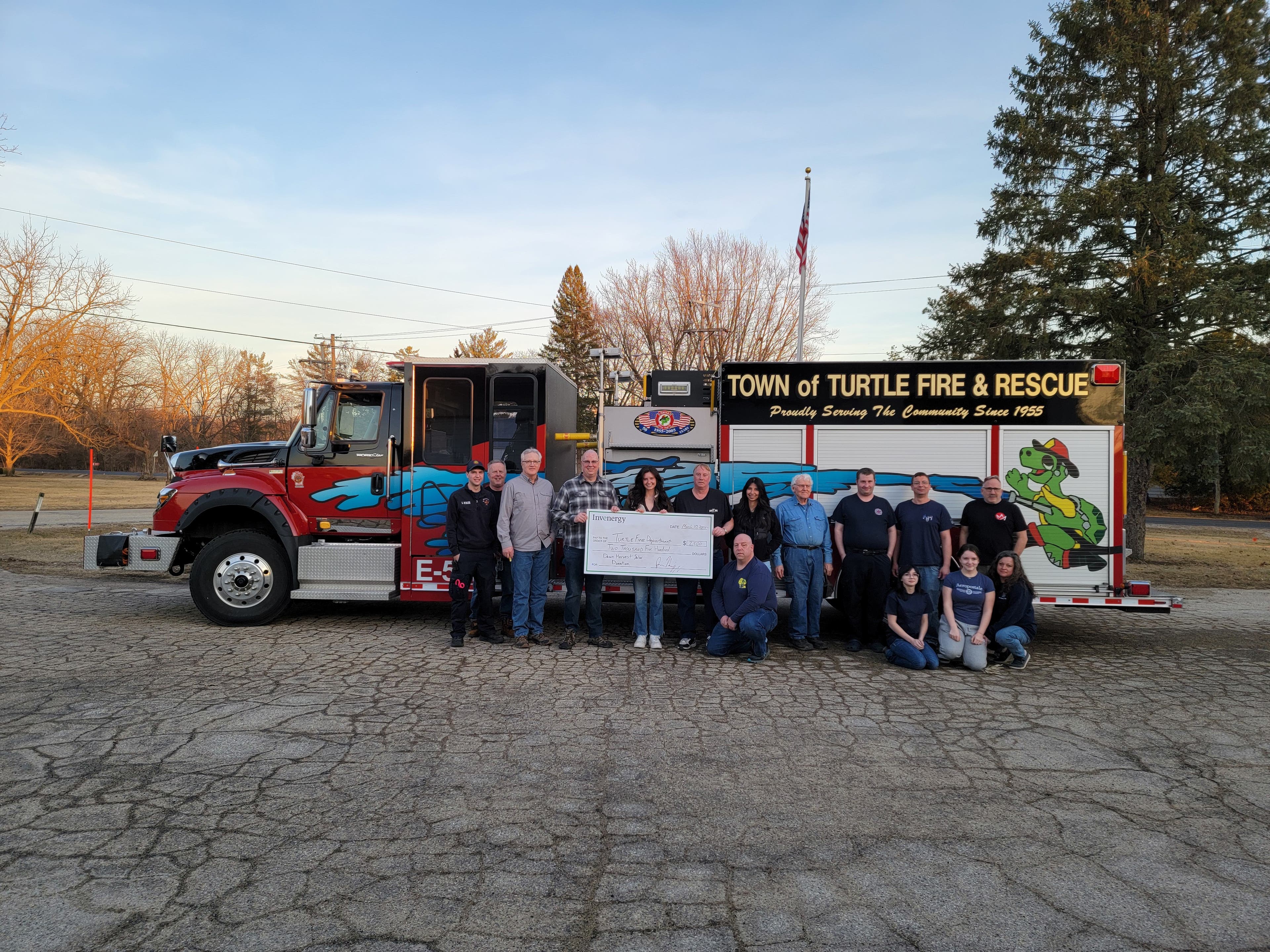 Dawn Harvest team presents a donation to the Town of Turtle Fire Department