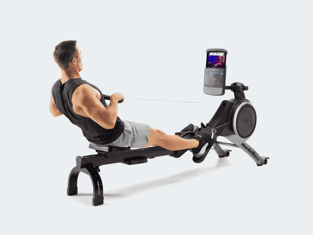 Man working out on iFIT rowing machine.