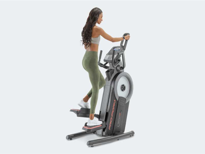 Woman uses ProForm elliptical machine