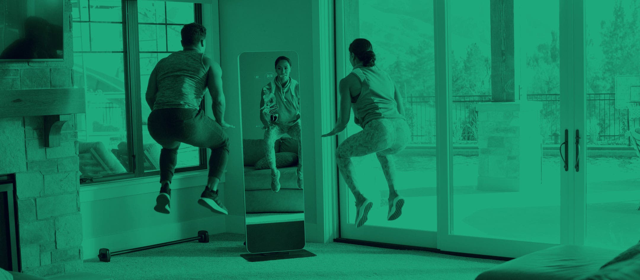 Man and woman exercising in-front of a fitness mirror 