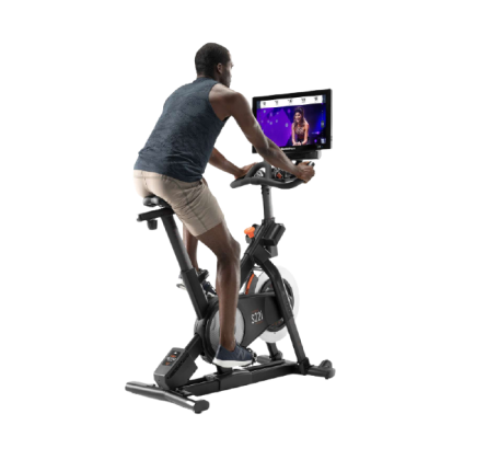 Man does a cycling workout on an iFIT-enabled bike