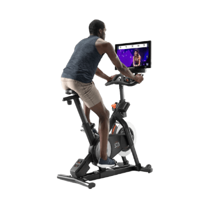 Man does a cycling workout on an iFIT-enabled bike