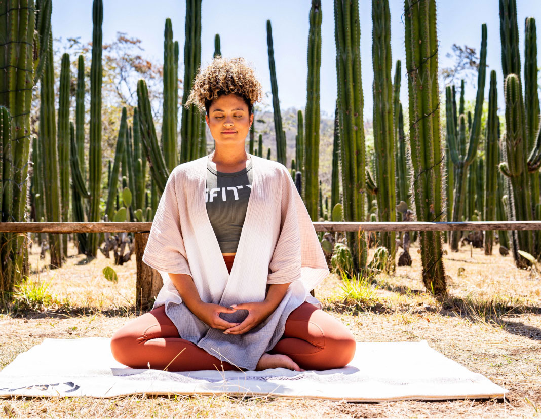 Woman does an iFIT meditation class