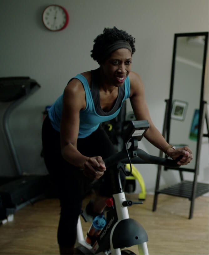 iFIT member works out with a bike class