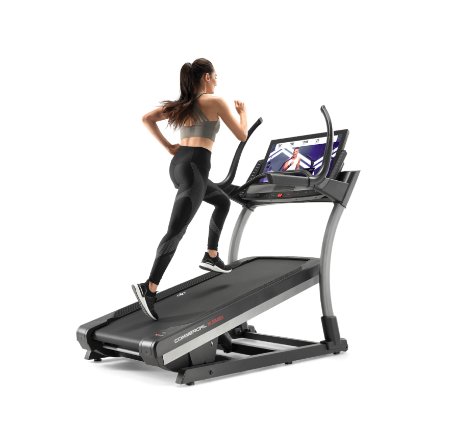 Woman running on incline trainer