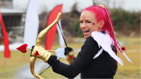 Trainer shooting an arrow at Love on the Run 5k 