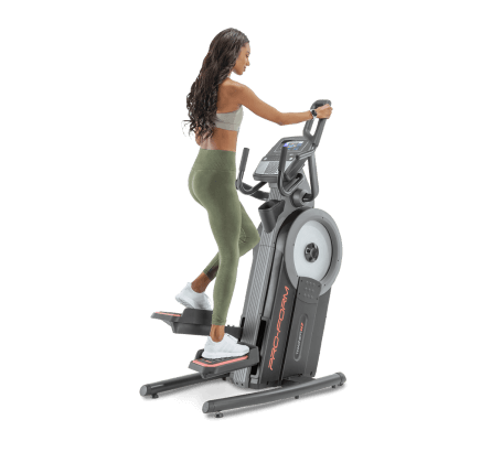 Woman does a cardio workout on an iFIT-enabled elliptical