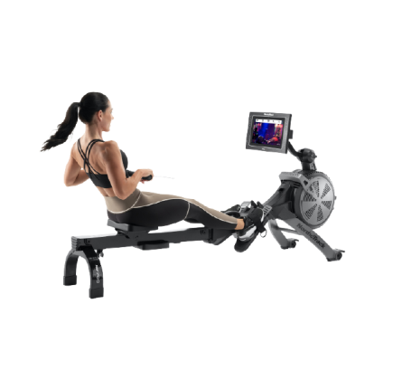 Woman does a rowing workout on an iFIT-enabled rower