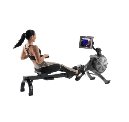 Woman does a rowing workout on an iFIT-enabled rower