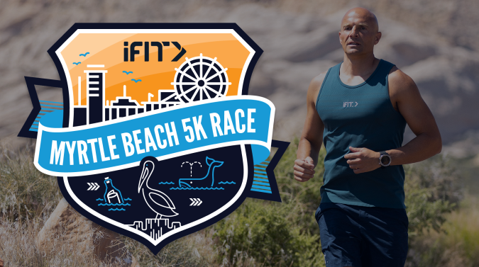 Manning running on beach with badge graphic