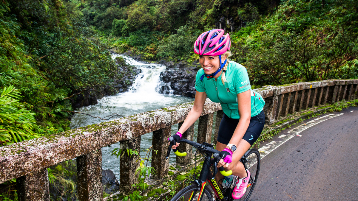 Personal trainer coaches an iFIT bike workout