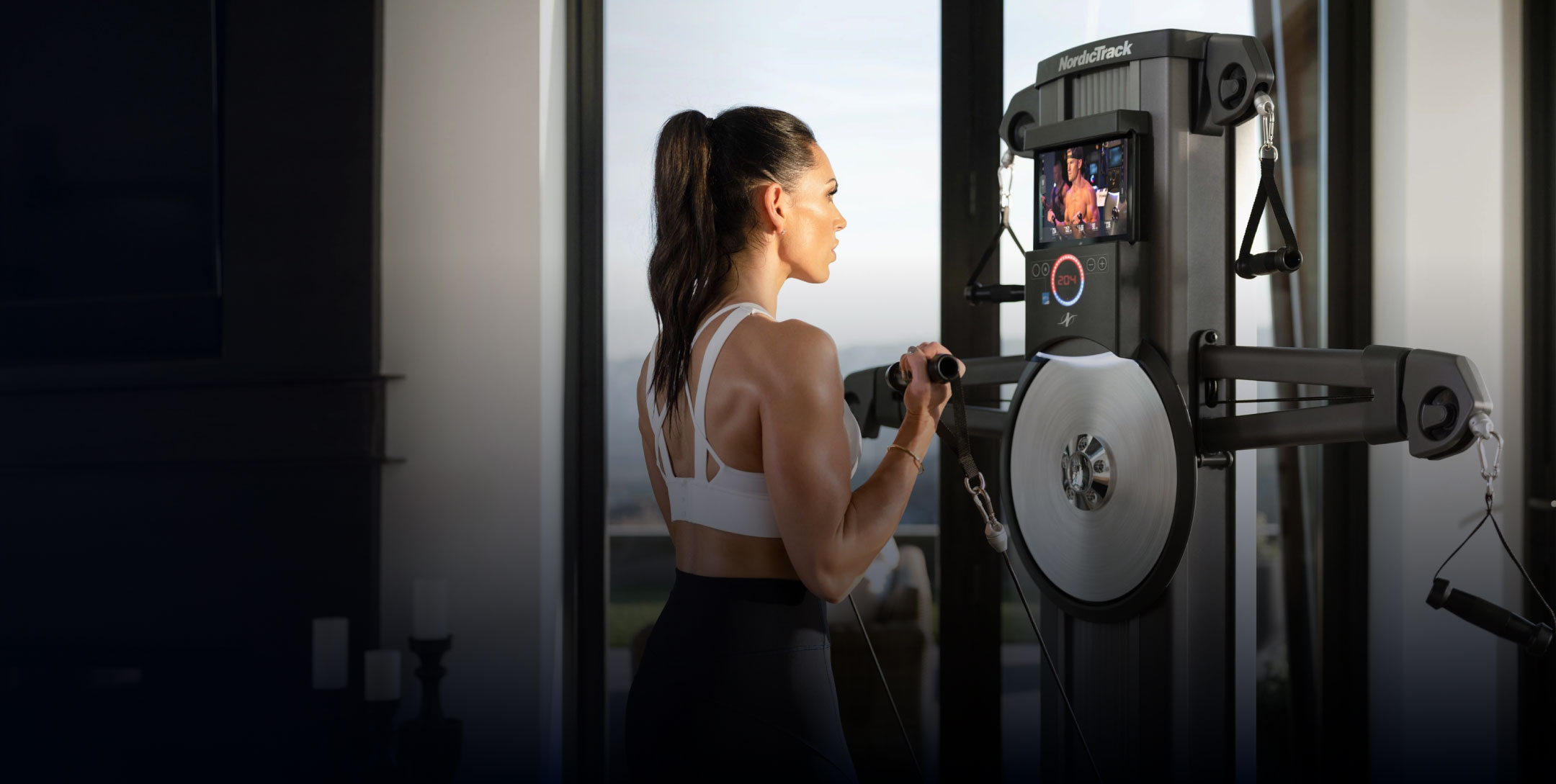 Woman exercising with NordicTrack Fusion Series cable machine