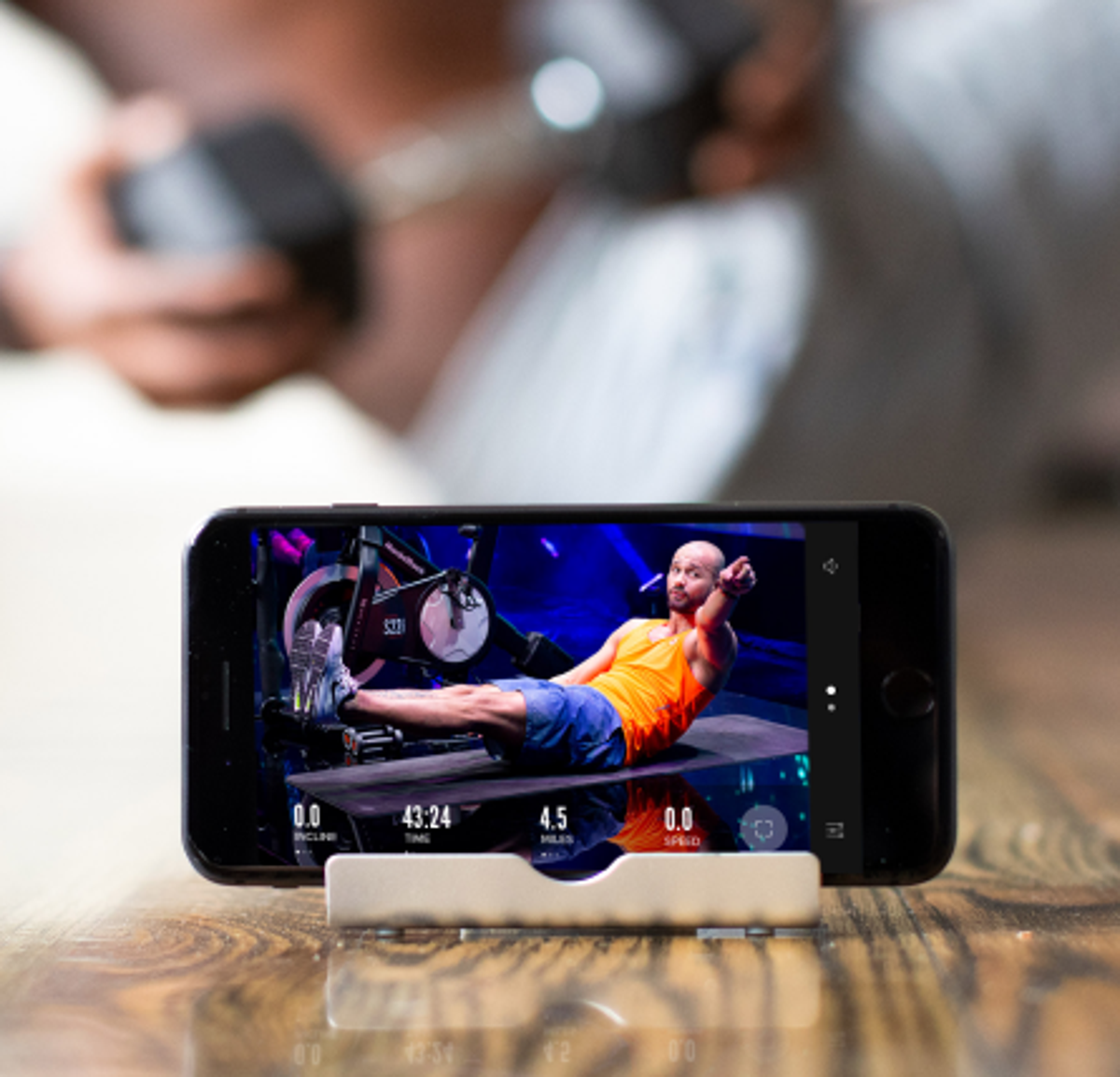 Person does an iFIT ab workout using their phone