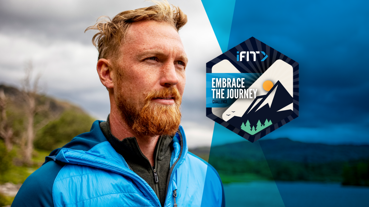 Personal trainer coaches an iFIT workout challenge