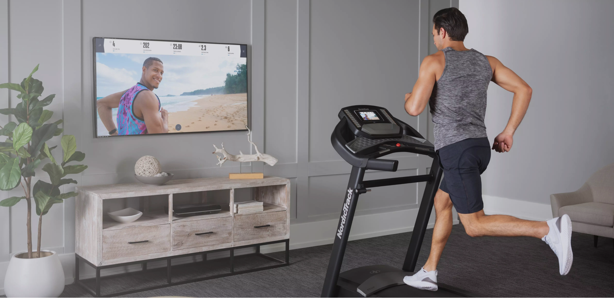 Man works out to an iFIT running class