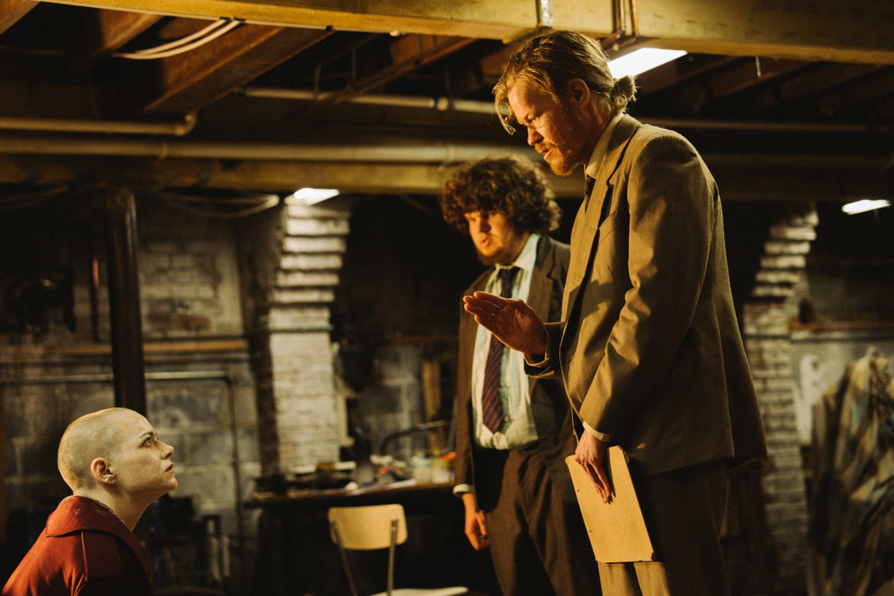 Michelle, Teddy and Don confronting one another in Teddy's basement in Bugonia