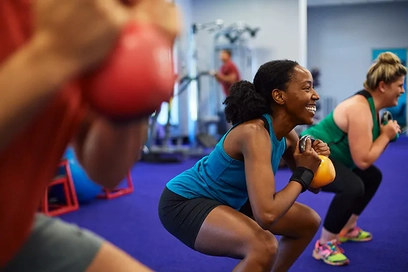Anytime Fitness members train together using kettlebells