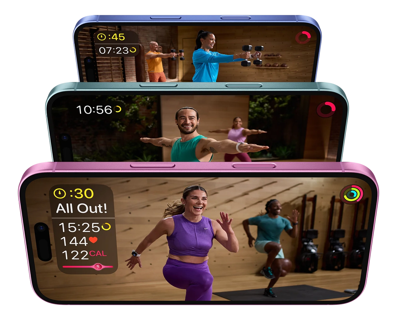 Three iPhones with Apple Fitness+ workout videos playing.