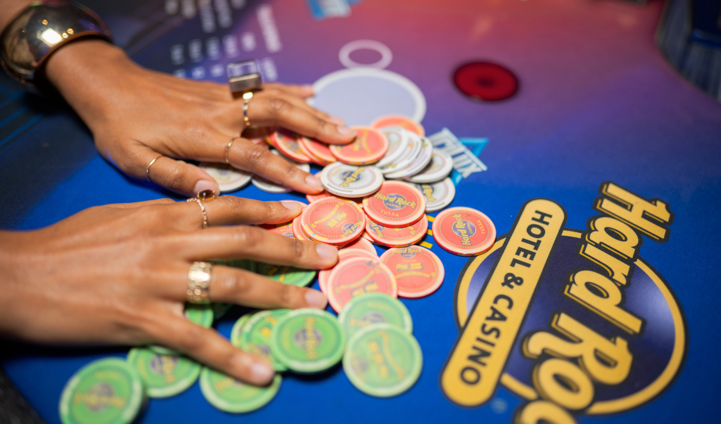 Hand grabbing a pile of poker chips