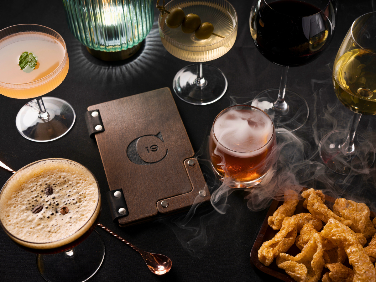 Upscale craft bourbon cocktail with bold, smoky presentation served in a sophisticated glass at Carvers on 19