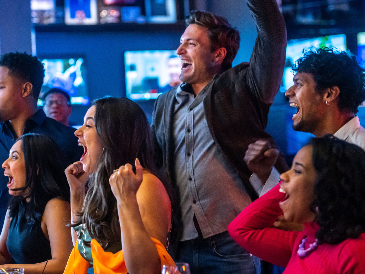 People Cheering at Sports Bar