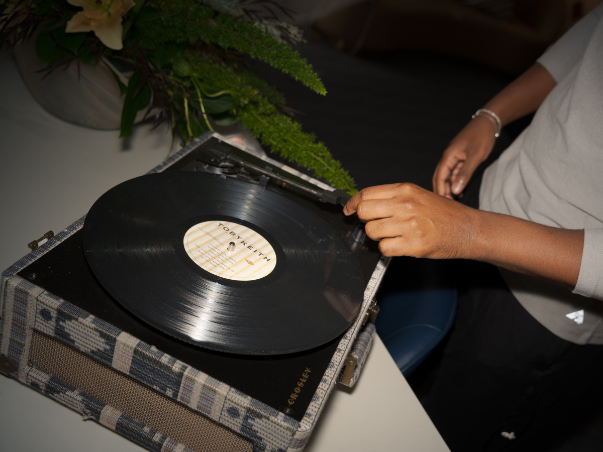 Guy Playing Vinyl on Record Player