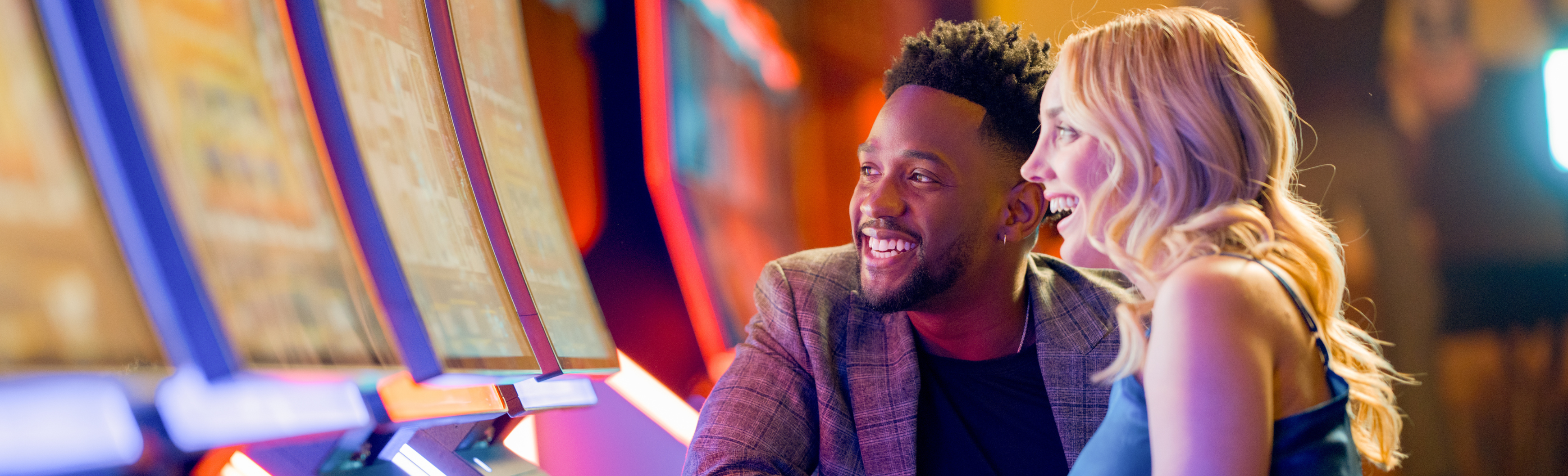 Couple Playing Slot Machine