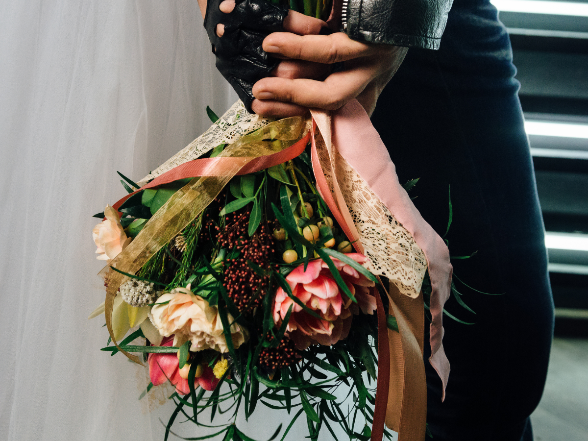 Bride & Groom Holding Wedding Flowers