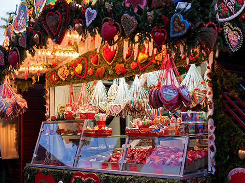 A stall in a market where cookies and other sweet goods are for sale