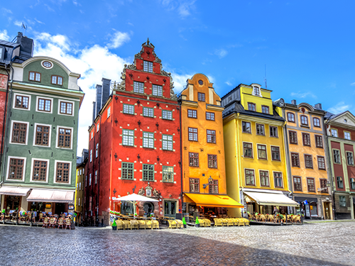 The colorful houses in Stockholm pictured from street level view