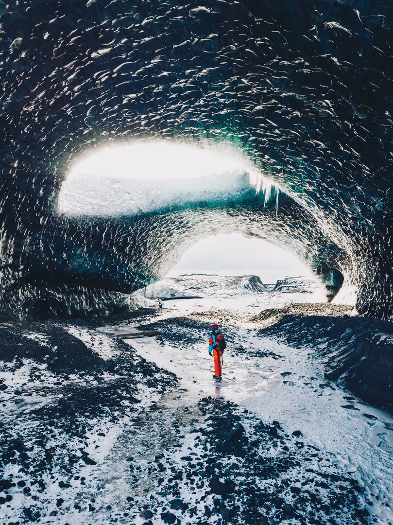 Tourist standing in ice cave