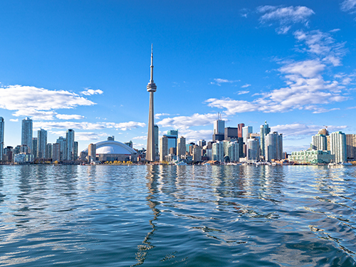 A cityscape of Toronto as pictured from across the water 