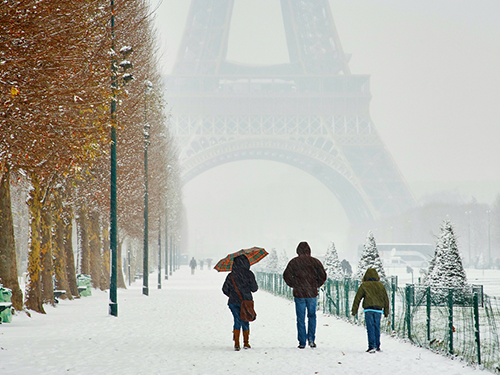 The Eiffel Tower and the banks of the river Seine on a snowy winter's day.