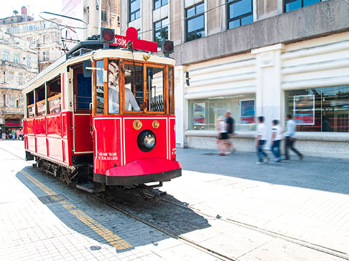 A red and white tram on the streets of Istanbul