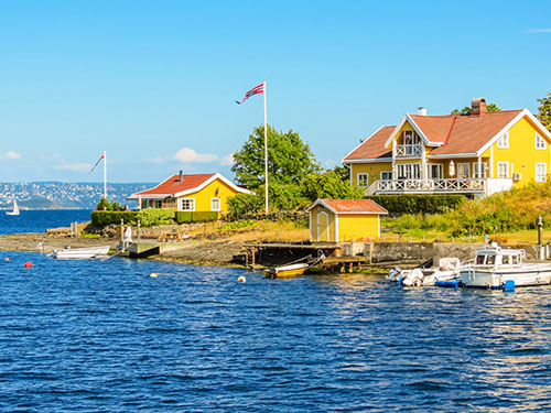 Yellow timber houses on an island in the Oslo Fjord