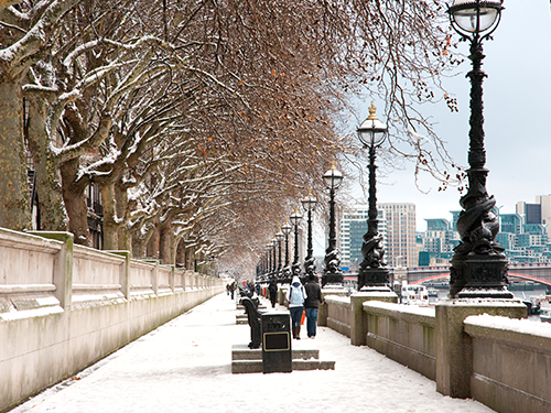 A snowy day in London as pictured from the side of the River Thames