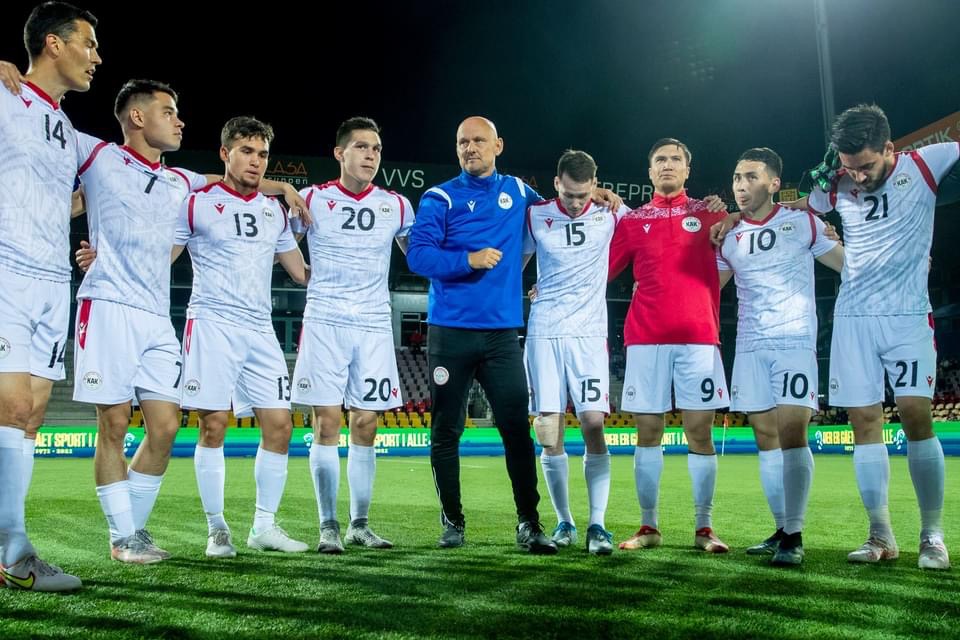Greenland coach Morten Rutkjær with team members on the field