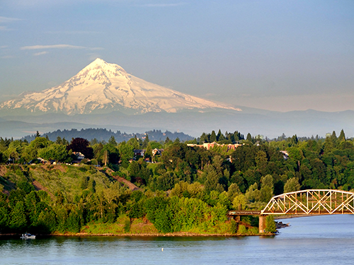 A picture of Portland set against the snow-capped Mount Hood in the background 