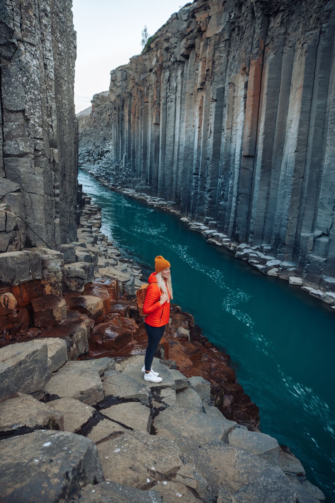 Ása Steinars standing in Studlagil canyon, located in the East of Iceland