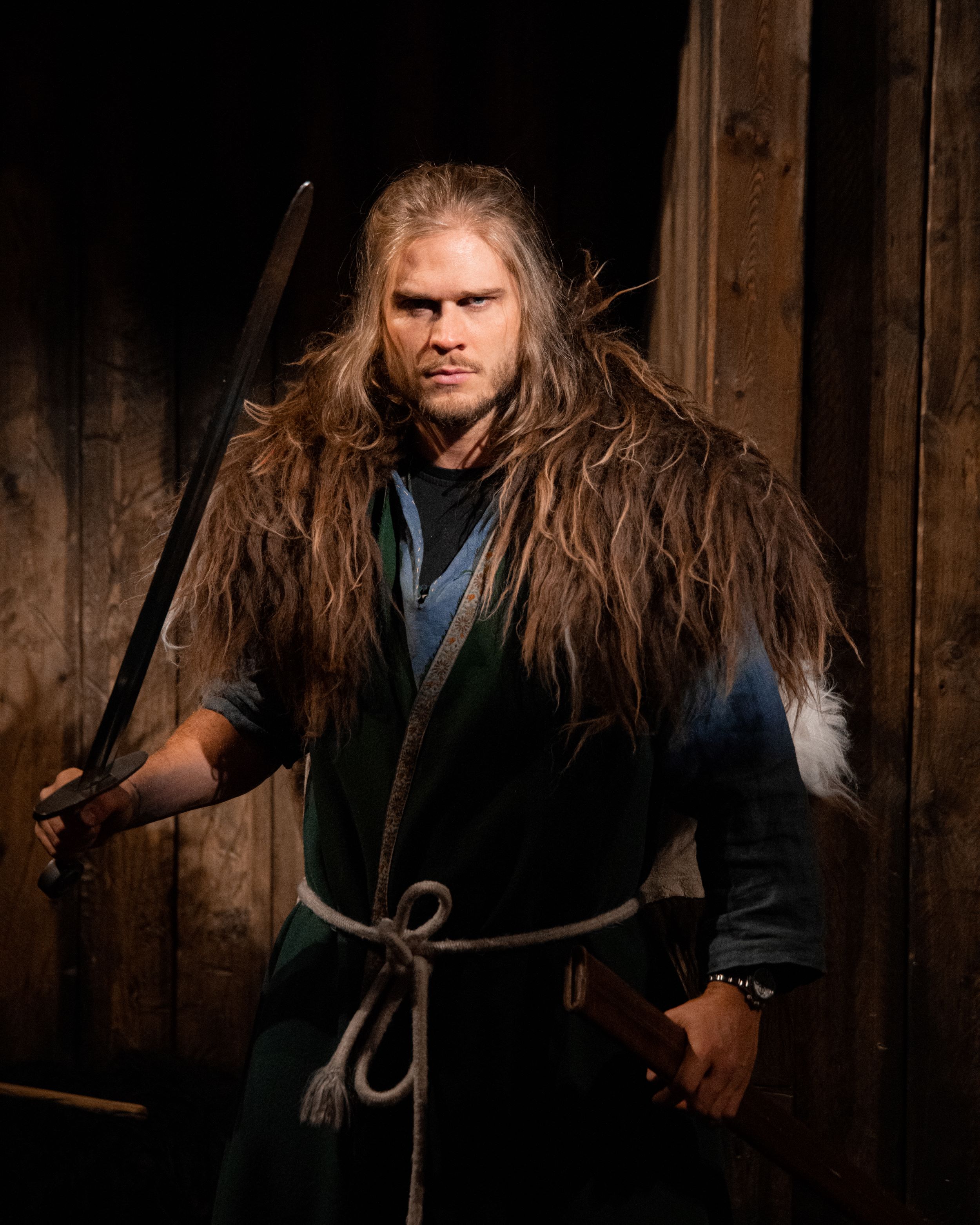 Rúrik Gíslason is dressed in a sheepskin shawl and other Viking dress at the Sauðárkrókur museum called 1238: The Battle of Iceland.