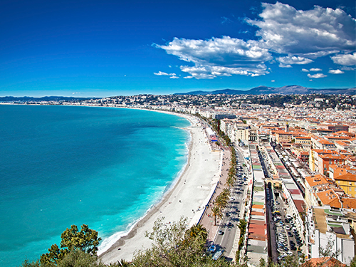 A panoramic aerial shot of the beach strip and coastline in Nice, France 
