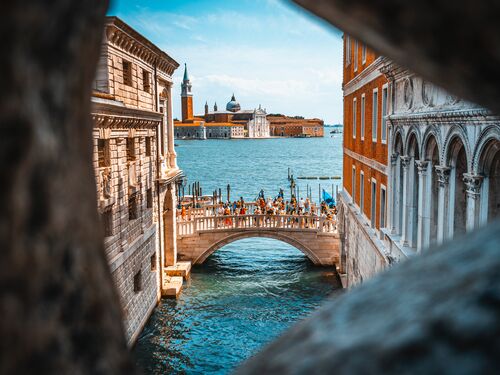 an artistic shot of a historic bridge in Venice