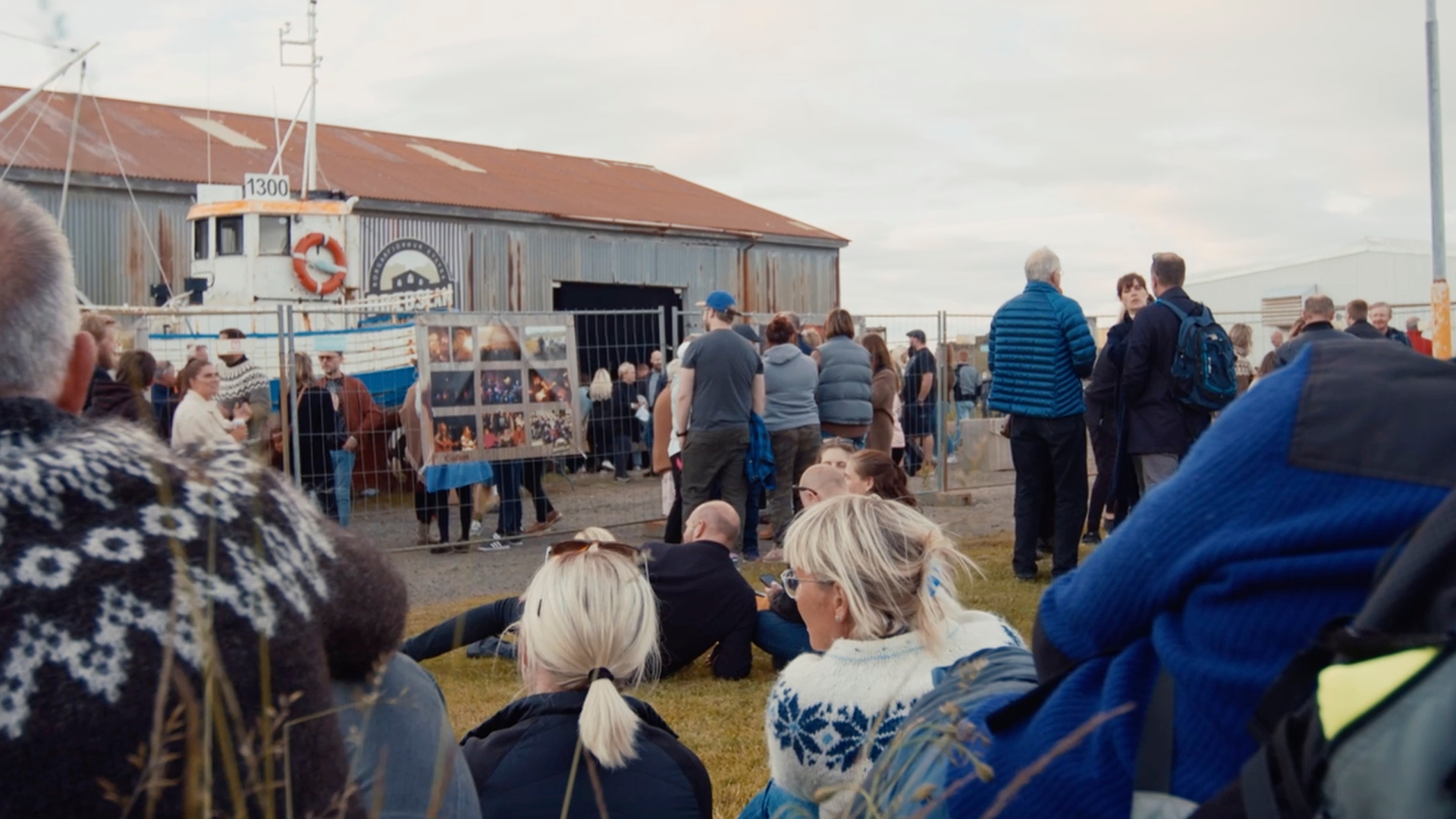 An audience gathers outside an abandoned fish factory for Braedslan music festival