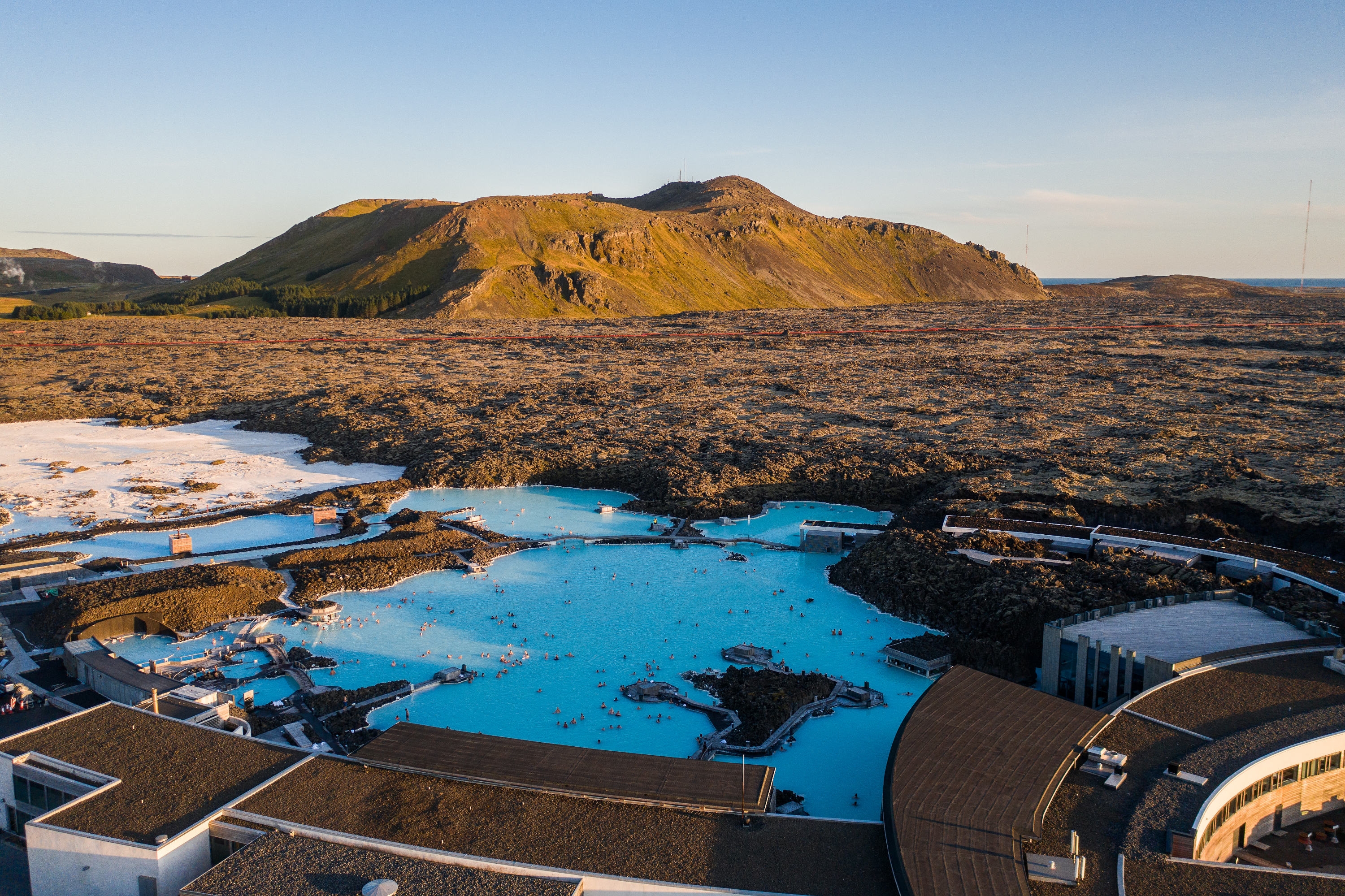 Aerial photo of Blue Lagoon geothermal bathing complex, with the mountain Þorbjörn in the background