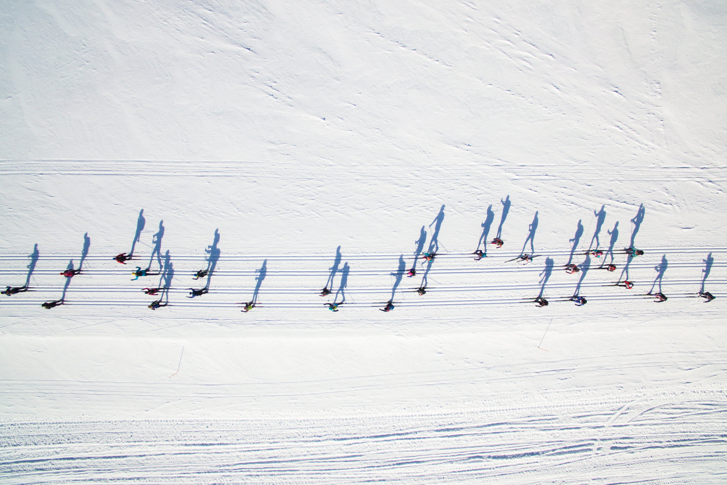 Aerial photo of cross-country skiers in the snow at Ísafjörður Ski Week in the Westfjords.