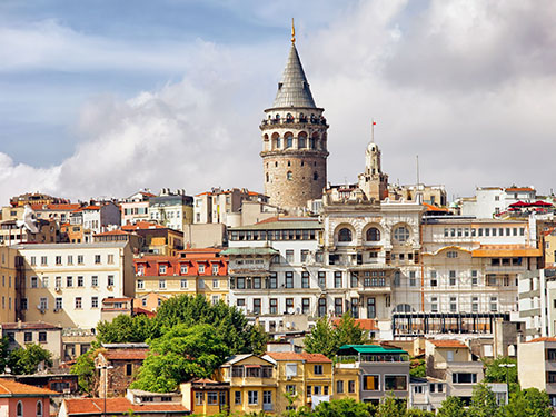 A view of the cityscape of Istanbul's old center, with the Galata Tower in the background